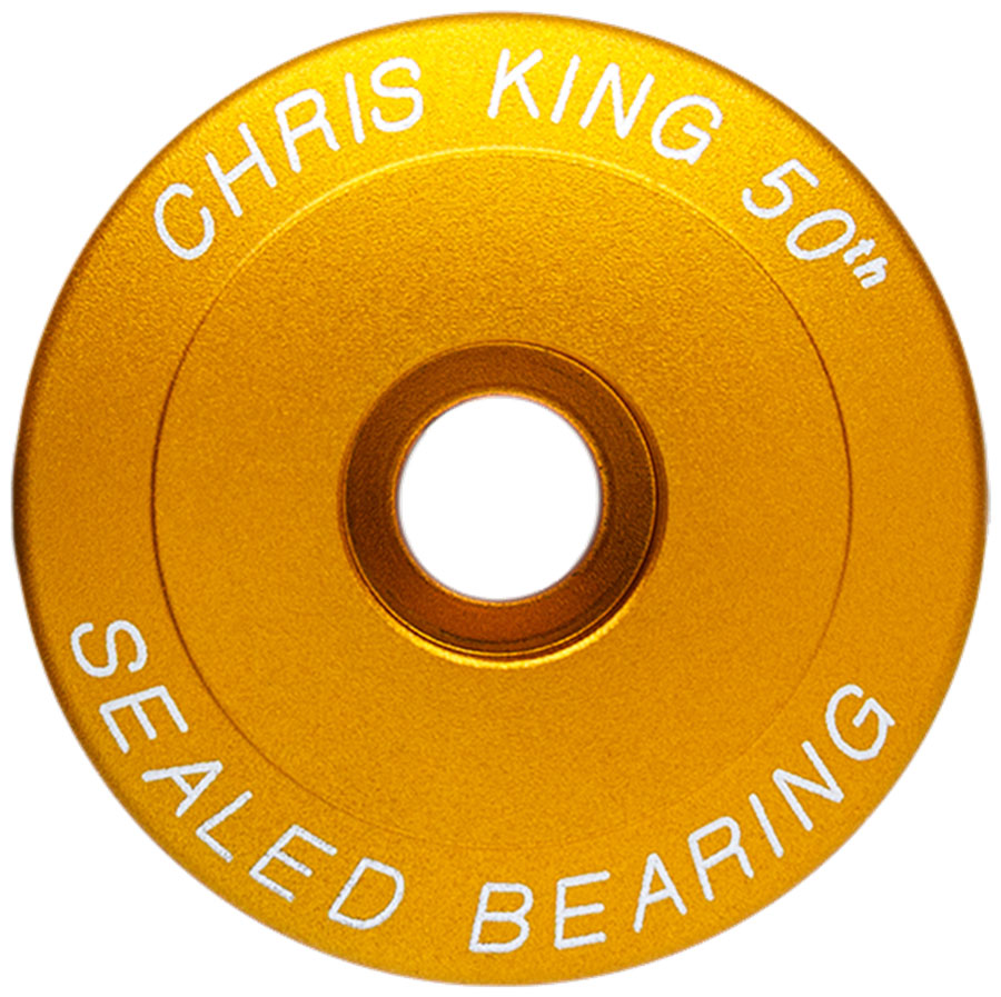 Chris King Headset Stem Cap - 1-1/8", Matte Gold 50th Anniversary MPN: PHS456Y2 UPC: 841529278842 Headset Top Cap Headset Stem Cap